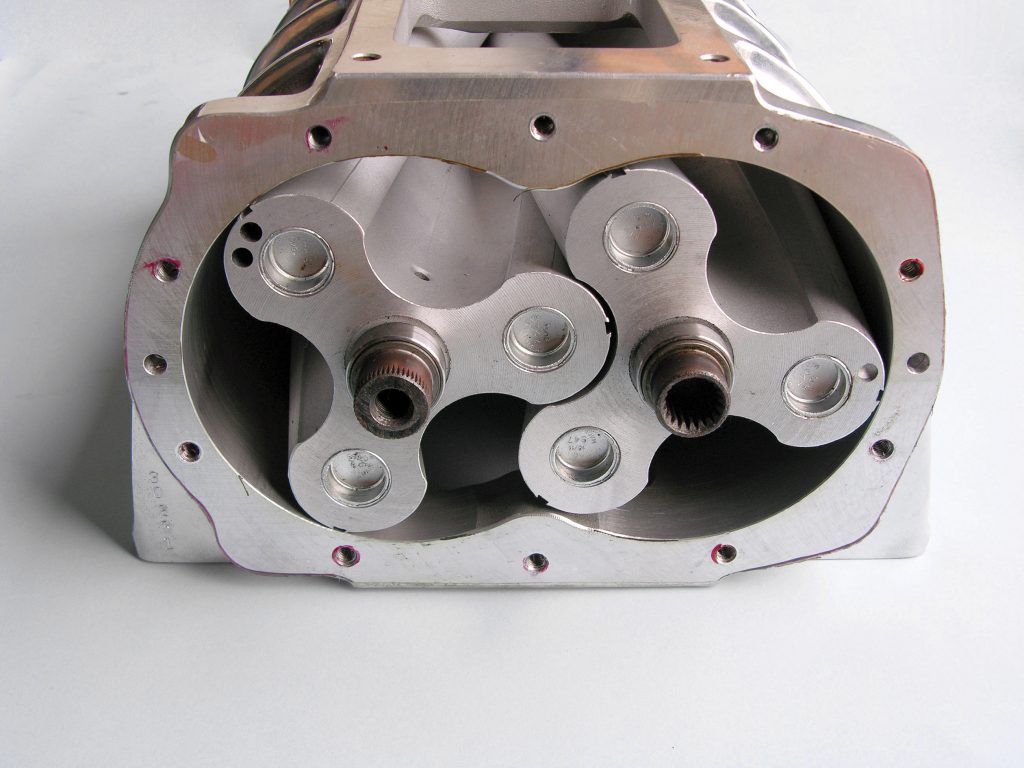 Unbolting the rear cover on a GMC/Roots-style supercharger case gives a good look at the three-lobed rotors. Rotors spin outwardly, forcing  compressed air/fuel mixture down into the intake manifold.
