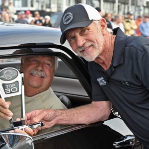 Bobby Alloway hands off a Top 30 Trophy to Scott Cooper for his 1970 Chevrolet El Camino.