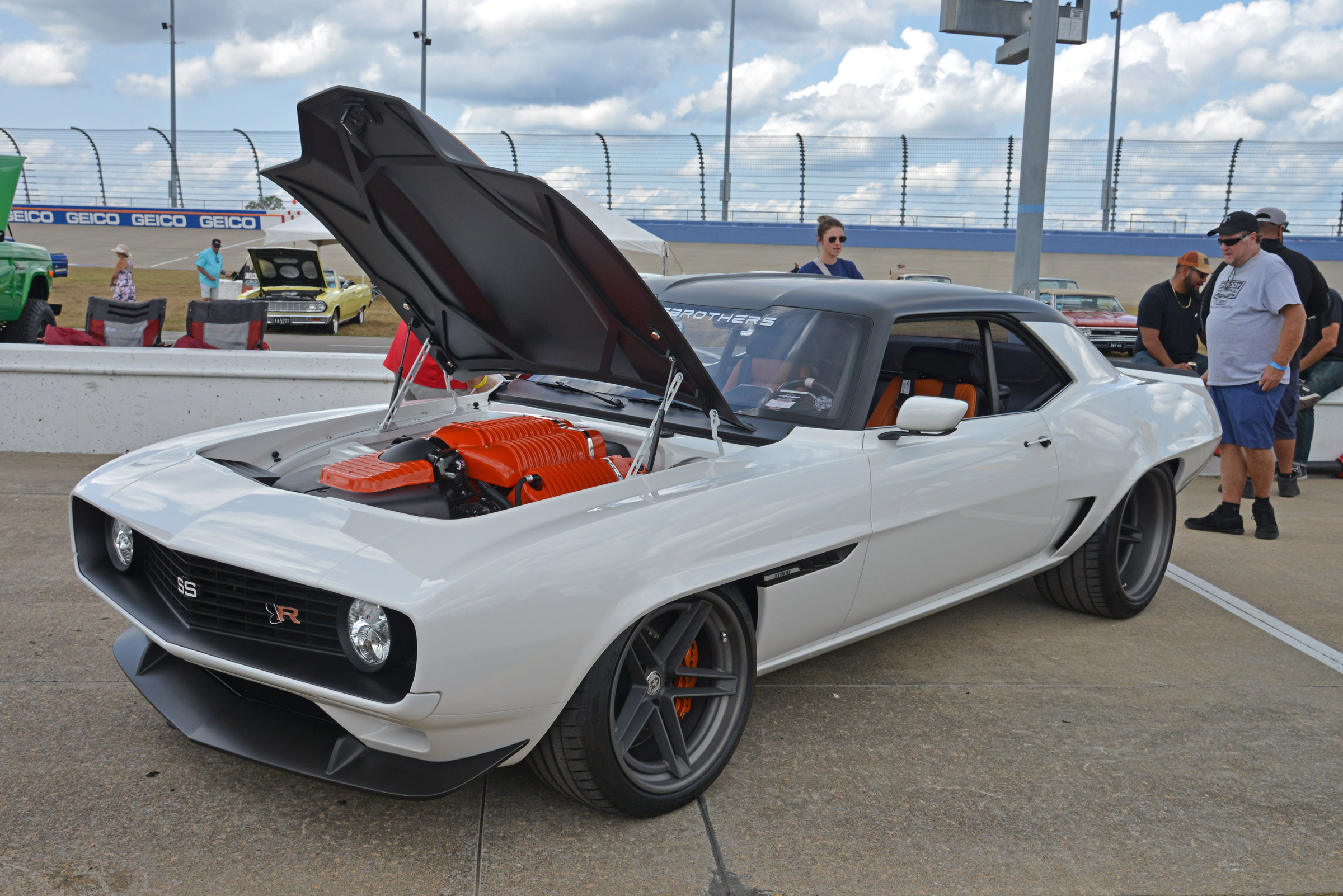 ’69 Camaro “Strode” -The Ringbrothers turned a stock ’69 Camaro into a carbon-fiber widebody masterpiece. Powered by a supercharged LS3 with a Tremec T-56 six-speed and wearing HRE wheels with Michelin Pilot Sport 4S tires, this 500–1000 hp beast blends brutal performance with bespoke interior luxury, all while weighing just 2,800 lbs.