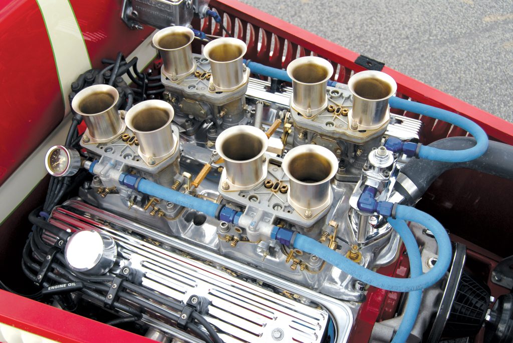 A Weber eight-stack induction tops the 355 Chevy small block, along with a Weiand intake and aluminum heads.