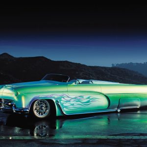 Dean Bryant had a vision when he built this custom, and in a short four months he turned a 
mundane ’56 Ford product into a rolling sculpture. The low stance was accomplished with Air Ride Technologies’ airbag suspension. The elegant machine rolls on Vogue tires wrapped around steel wheels with Cadillac hubcaps.